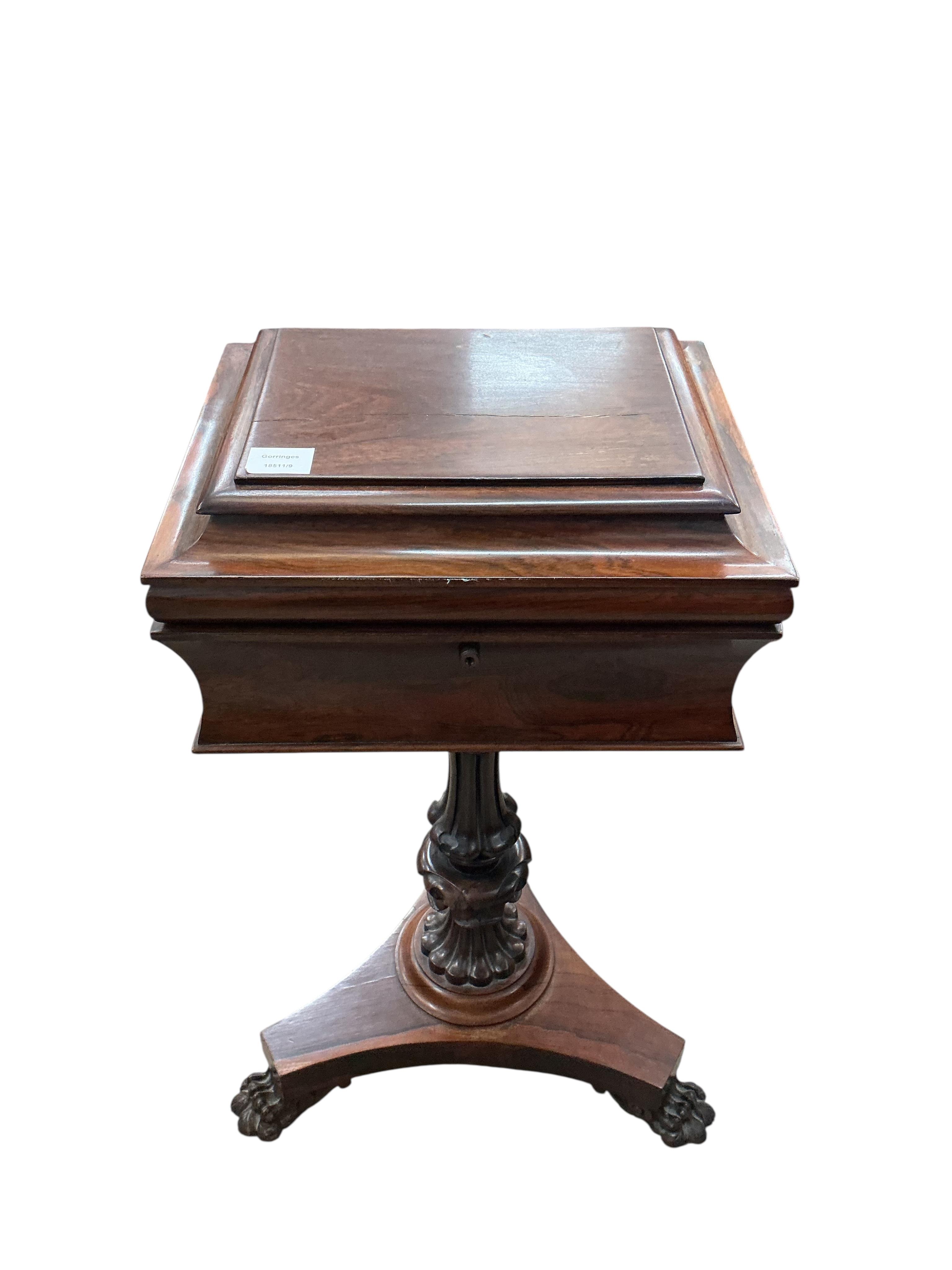An early Victorian rosewood teapoy, on triangular platform and lion's paw feet, width 40cm, depth 33cm, height 78cm